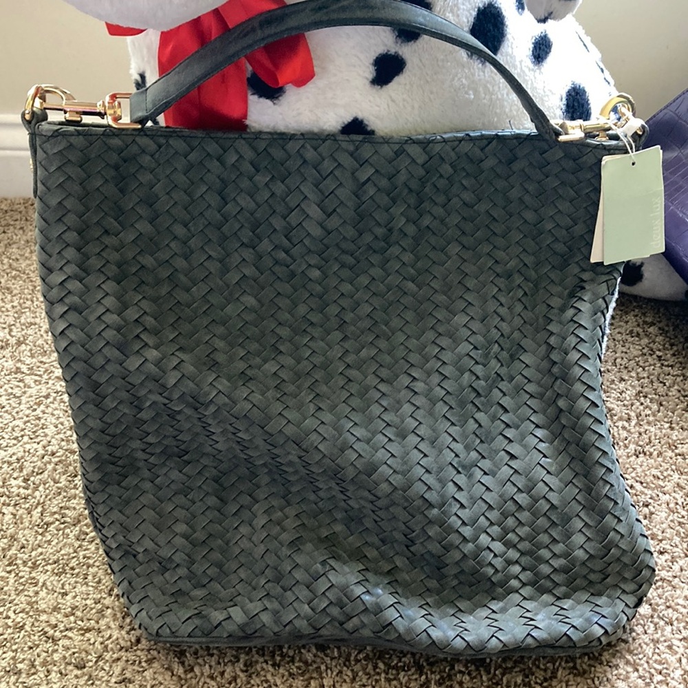 Never worn, gray woven bag.